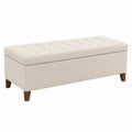 Banc de rangement rectangulaire en tissu beige avec pieds en bois